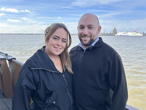 Captain Jack Easdown and his girlfriend pictured on the derry with Wirral in the background
