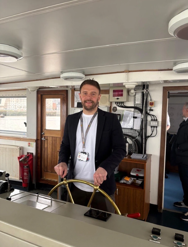 Ian Hayman, Marine Operations Manager, at the wheel