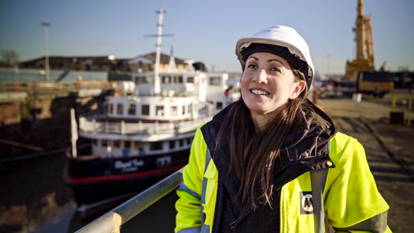 Louise Robinson, Marine Maintenance Manager pictured in front of Royal Iris in dry dock.